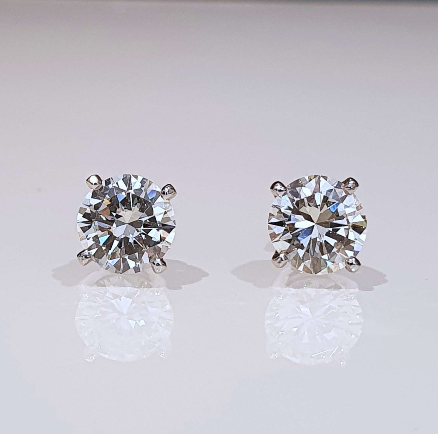 Diamond stud earrings 3.77 carats total