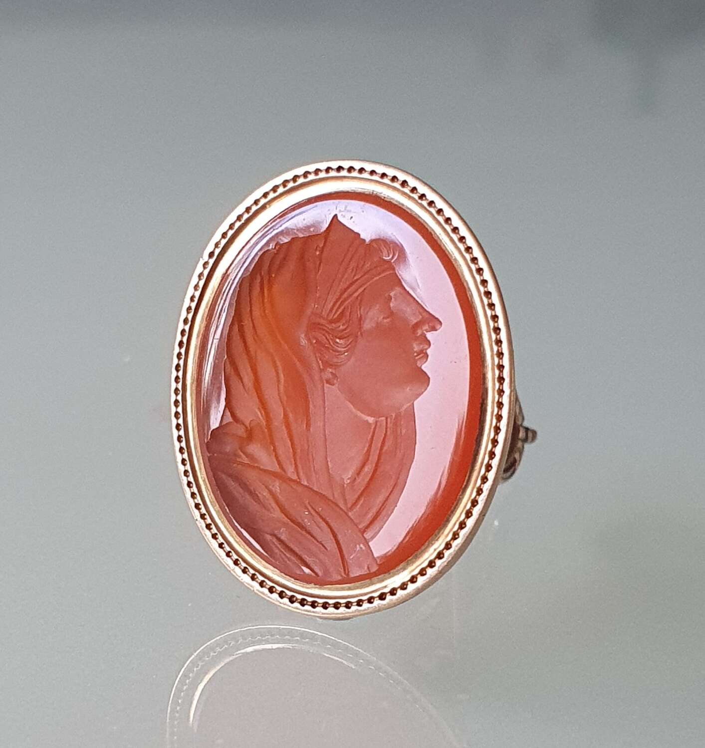 Gold fob seal with intaglio of a classical female head