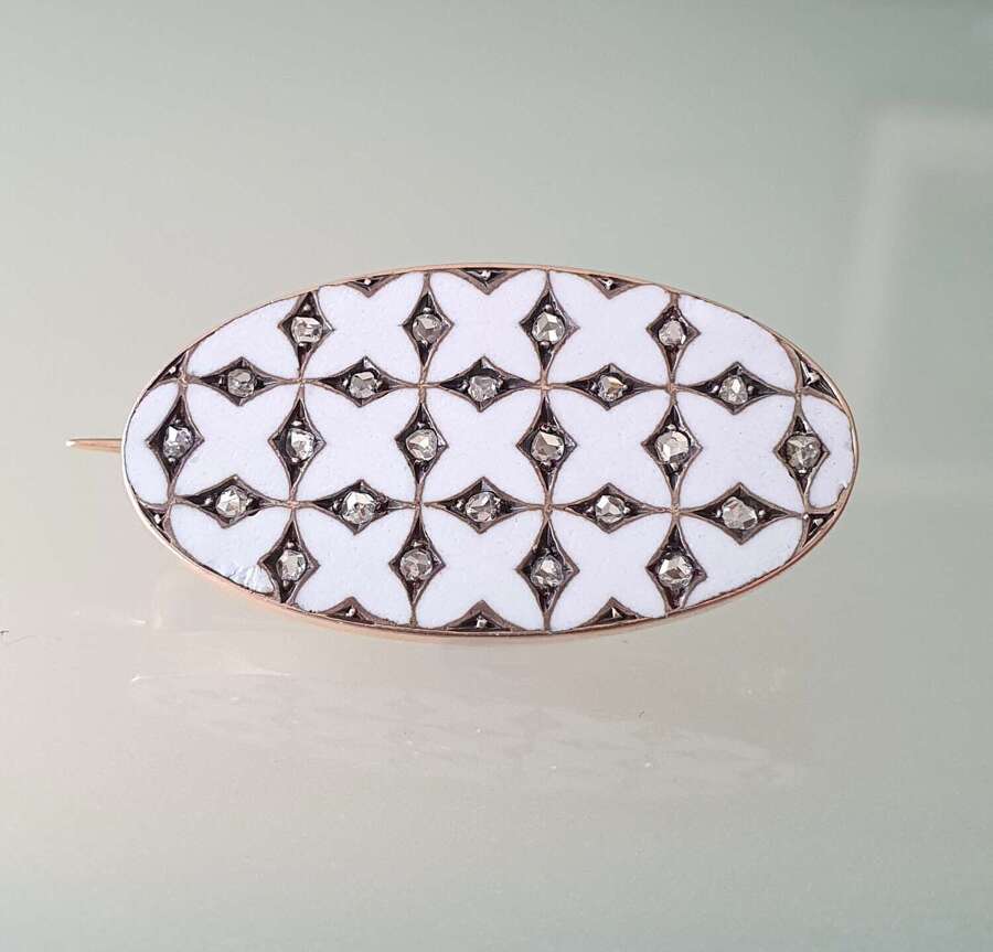 White enamel and diamond brooch