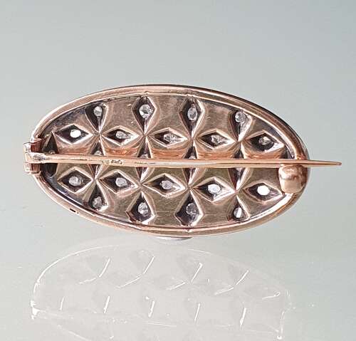 White enamel and diamond brooch